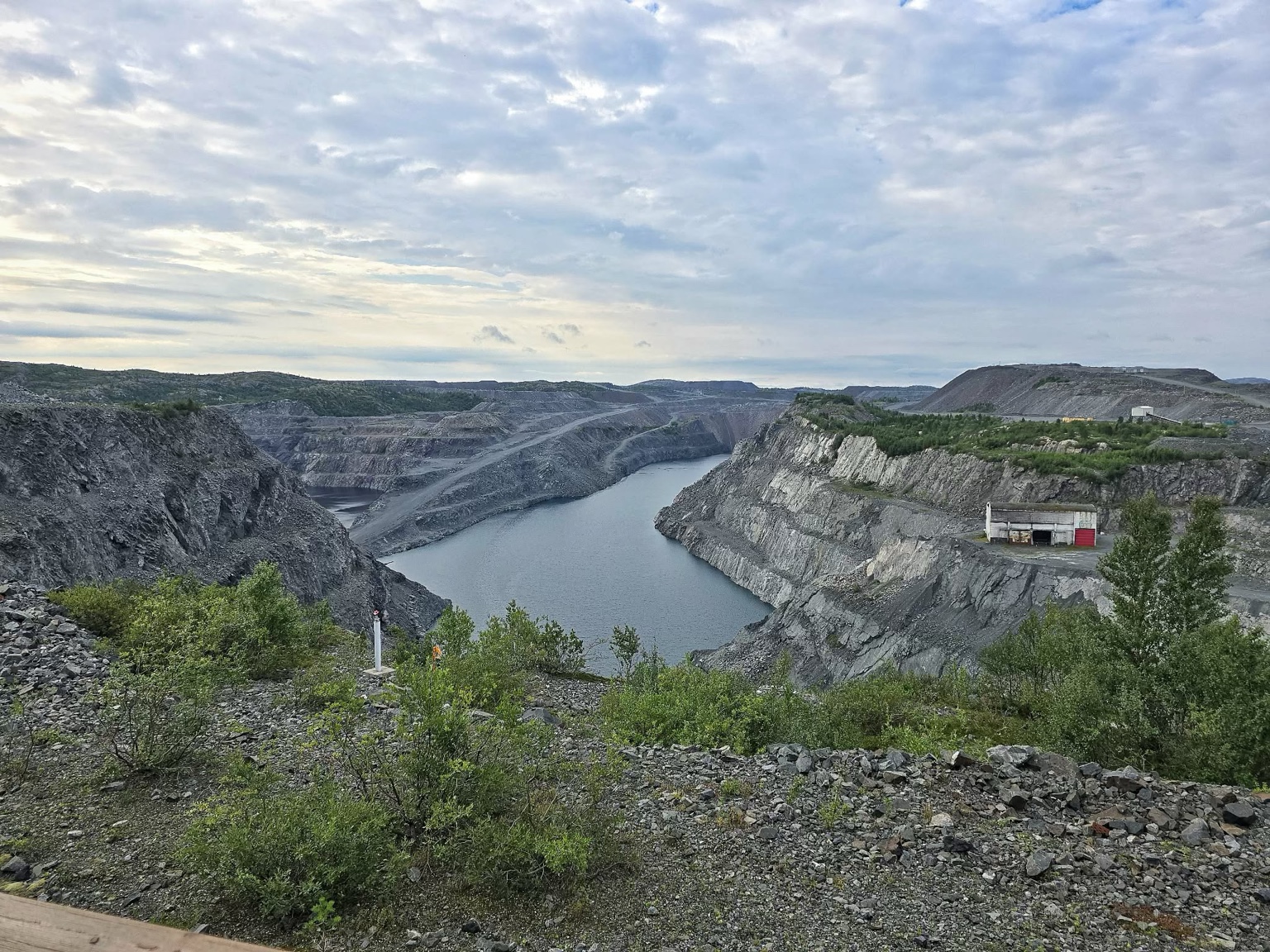 Open-pit quarry and water at Iron Mine in Kirkenes
